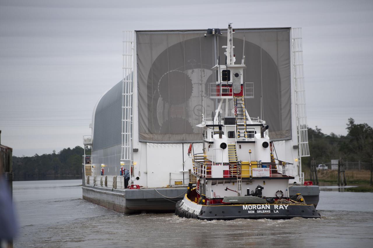 The first flight core stage for NASA’s new Space Launch System rocket arrived at Stennis Space Center on Jan. 12 for a series of tests prior to its maiden Artemis I flight. The core stage was transported from Michoud Assembly Facility in New Orleans to the B-2 Test Stand dock at Stennis aboard NASA’s Pegasus barge. Soon after arrival, the stage was rolled off of Pegasus onto the B-2 Test Stand tarmac. After the stage is lifted and installed on the B-2 stand, it will undergo a series of “Green Run” systems test that represent the first integrated testing of its sophisticated systems.