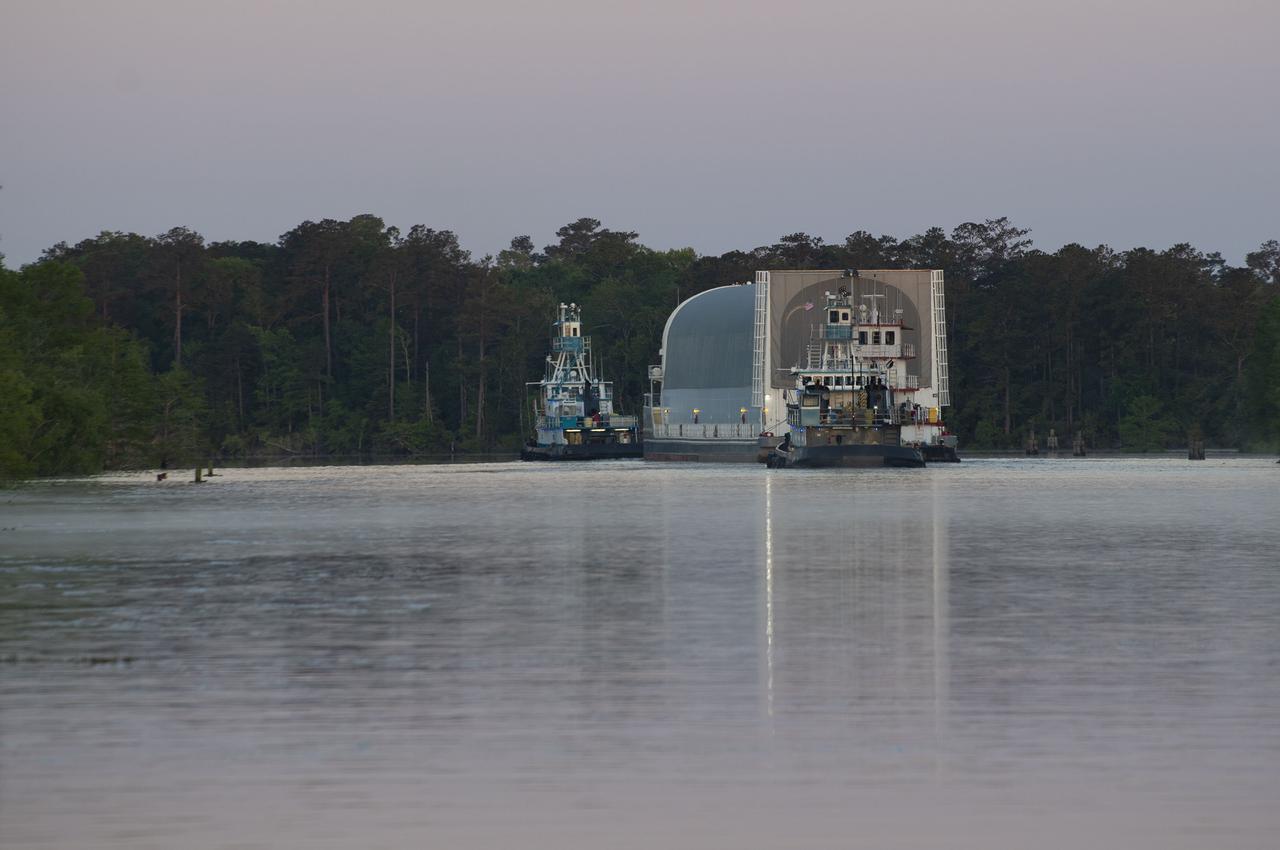 The first core stage of NASA’s Space Launch System (SLS) rocket, loaded onto the agency’s Pegasus barge, departs Stennis Space Center near Bay St. Louis, Mississippi, headed to Kennedy Space Center in Florida. The departure of the core stage in mid-April 2021 followed completion of a Green Run test series of the stage systems in preparation for its launch on the Artemis I mission. The Green Run series concluded with a March 18 hot fire of the stage’s four RS-25 engines on the B-2 Test Stand at Stennis, just as during an actual launch. Following refurbishment work, the stage was removed from the B-2 stand and loaded onto the Pegasus barge for transport. Once at Kennedy, the will be integrated with the rest of SLS rocket and prepared for the launch of the Artemis I mission to the Moon. Photo Credit: NASA