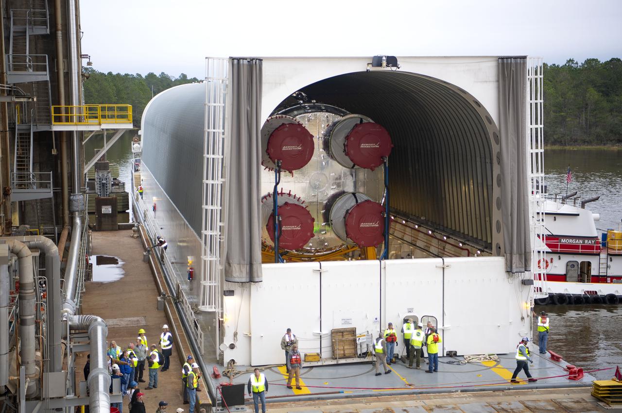 The first flight core stage for NASA’s new Space Launch System rocket arrived at Stennis Space Center on Jan. 12 for a series of tests prior to its maiden Artemis I flight. The core stage was transported from Michoud Assembly Facility in New Orleans to the B-2 Test Stand dock at Stennis aboard NASA’s Pegasus barge. Soon after arrival, the stage was rolled off of Pegasus onto the B-2 Test Stand tarmac. After the stage is lifted and installed on the B-2 stand, it will undergo a series of “Green Run” systems test that represent the first integrated testing of its sophisticated systems.