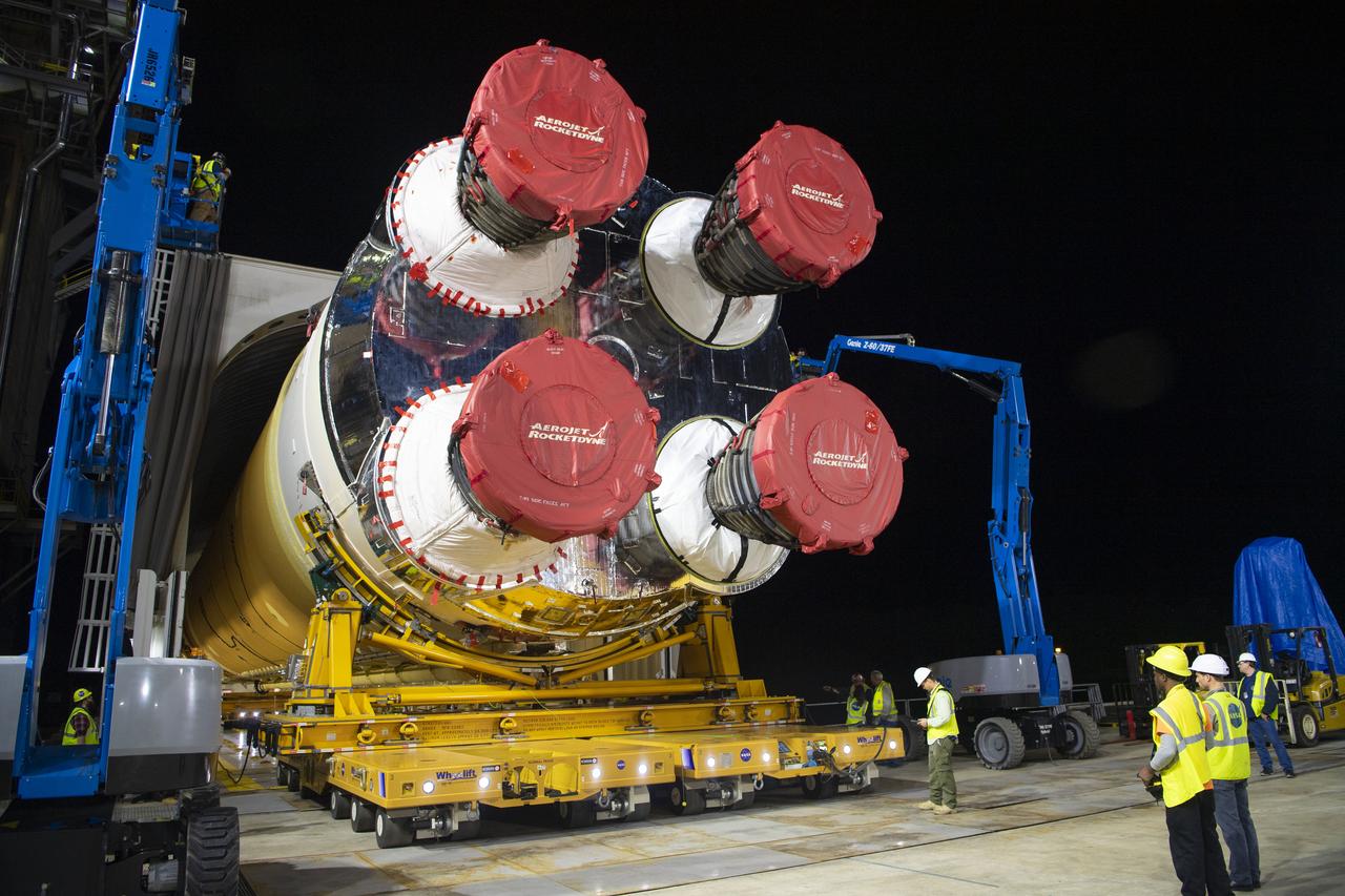 The first flight core stage for NASA’s new Space Launch System rocket arrived at Stennis Space Center on Jan. 12 for a series of tests prior to its maiden Artemis I flight. The core stage was transported from Michoud Assembly Facility in New Orleans to the B-2 Test Stand dock at Stennis aboard NASA’s Pegasus barge. Soon after arrival, the stage was rolled off of Pegasus onto the B-2 Test Stand tarmac. After the stage is lifted and installed on the B-2 stand, it will undergo a series of “Green Run” systems test that represent the first integrated testing of its sophisticated systems.
