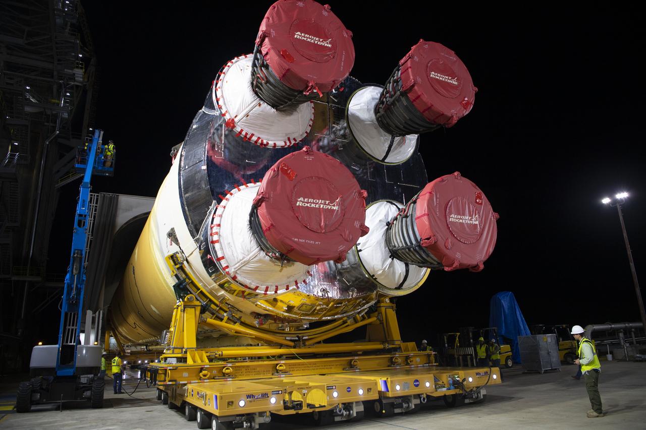 The first flight core stage for NASA’s new Space Launch System rocket arrived at Stennis Space Center on Jan. 12 for a series of tests prior to its maiden Artemis I flight. The core stage was transported from Michoud Assembly Facility in New Orleans to the B-2 Test Stand dock at Stennis aboard NASA’s Pegasus barge. Soon after arrival, the stage was rolled off of Pegasus onto the B-2 Test Stand tarmac. After the stage is lifted and installed on the B-2 stand, it will undergo a series of “Green Run” systems test that represent the first integrated testing of its sophisticated systems.