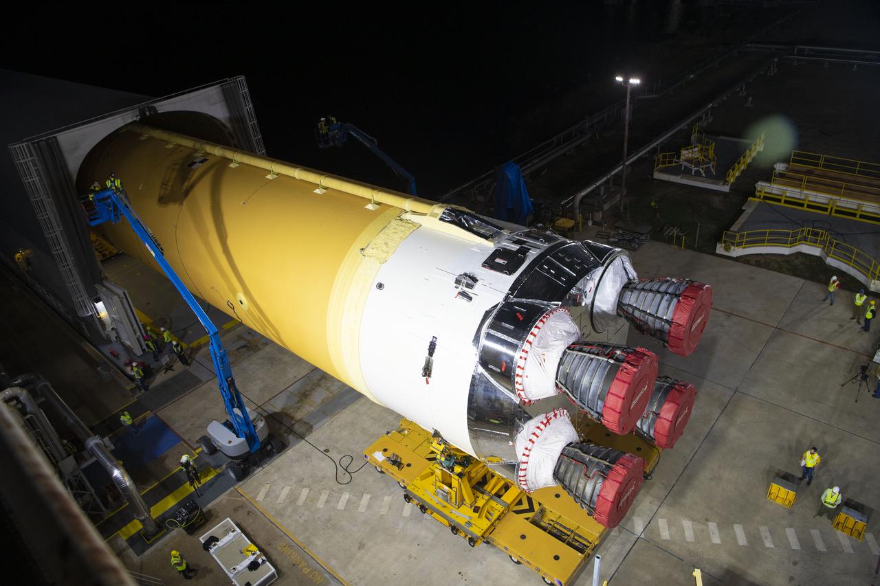 The first flight core stage for NASA’s new Space Launch System rocket arrived at Stennis Space Center on Jan. 12 for a series of tests prior to its maiden Artemis I flight. The core stage was transported from Michoud Assembly Facility in New Orleans to the B-2 Test Stand dock at Stennis aboard NASA’s Pegasus barge. Soon after arrival, the stage was rolled off of Pegasus onto the B-2 Test Stand tarmac. After the stage is lifted and installed on the B-2 stand, it will undergo a series of “Green Run” systems test that represent the first integrated testing of its sophisticated systems.