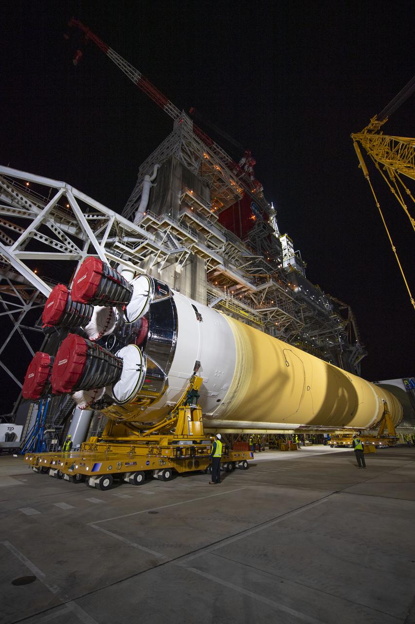 The first flight core stage for NASA’s new Space Launch System rocket arrived at Stennis Space Center on Jan. 12 for a series of tests prior to its maiden Artemis I flight. The core stage was transported from Michoud Assembly Facility in New Orleans to the B-2 Test Stand dock at Stennis aboard NASA’s Pegasus barge. Soon after arrival, the stage was rolled off of Pegasus onto the B-2 Test Stand tarmac. After the stage is lifted and installed on the B-2 stand, it will undergo a series of “Green Run” systems test that represent the first integrated testing of its sophisticated systems.
