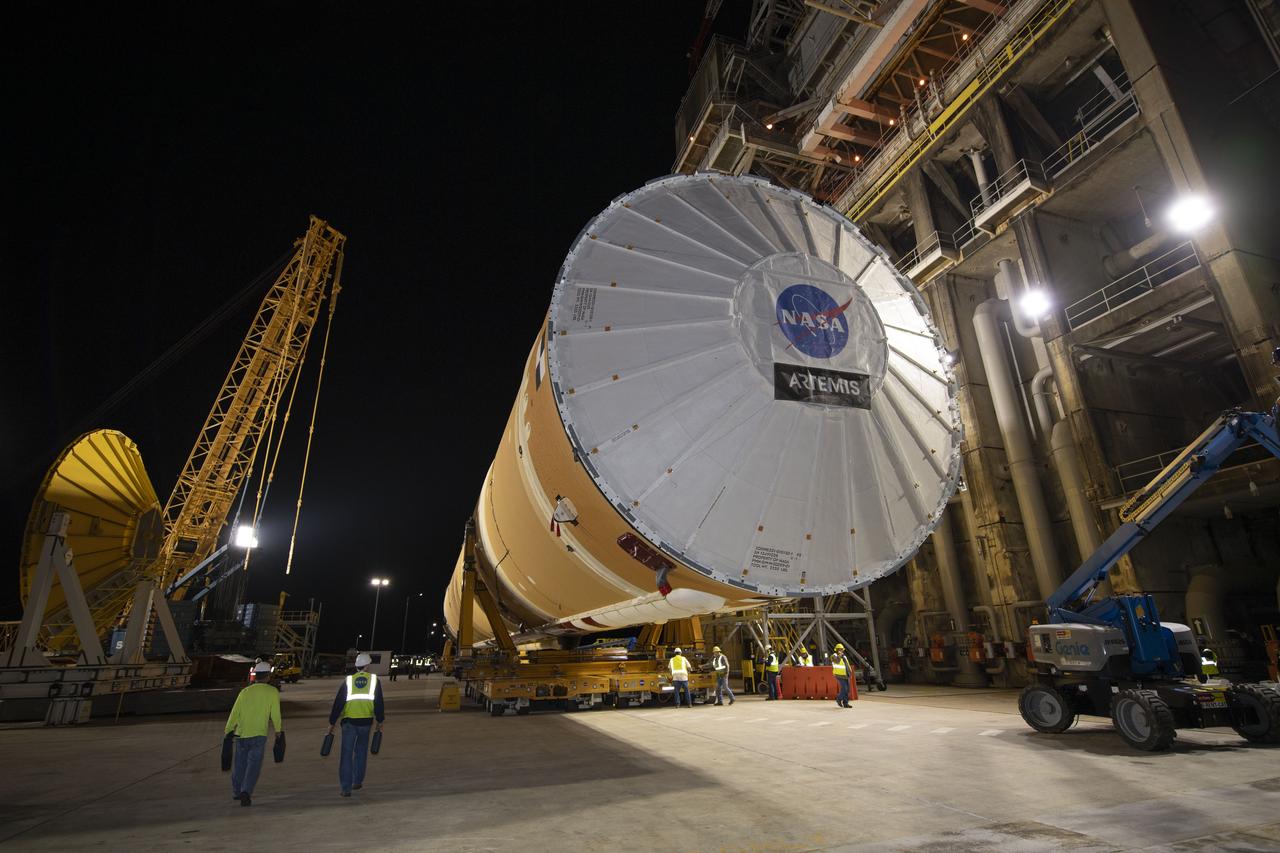 The first flight core stage for NASA’s new Space Launch System rocket arrived at Stennis Space Center on Jan. 12 for a series of tests prior to its maiden Artemis I flight. The core stage was transported from Michoud Assembly Facility in New Orleans to the B-2 Test Stand dock at Stennis aboard NASA’s Pegasus barge. Soon after arrival, the stage was rolled off of Pegasus onto the B-2 Test Stand tarmac. After the stage is lifted and installed on the B-2 stand, it will undergo a series of “Green Run” systems test that represent the first integrated testing of its sophisticated systems.