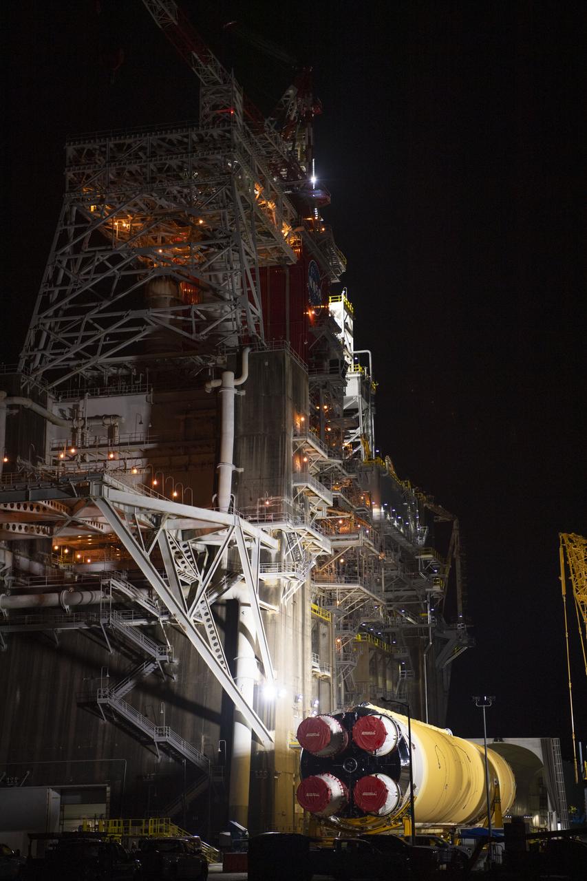 The first flight core stage for NASA’s new Space Launch System rocket arrived at Stennis Space Center on Jan. 12 for a series of tests prior to its maiden Artemis I flight. The core stage was transported from Michoud Assembly Facility in New Orleans to the B-2 Test Stand dock at Stennis aboard NASA’s Pegasus barge. Soon after arrival, the stage was rolled off of Pegasus onto the B-2 Test Stand tarmac. After the stage is lifted and installed on the B-2 stand, it will undergo a series of “Green Run” systems test that represent the first integrated testing of its sophisticated systems.