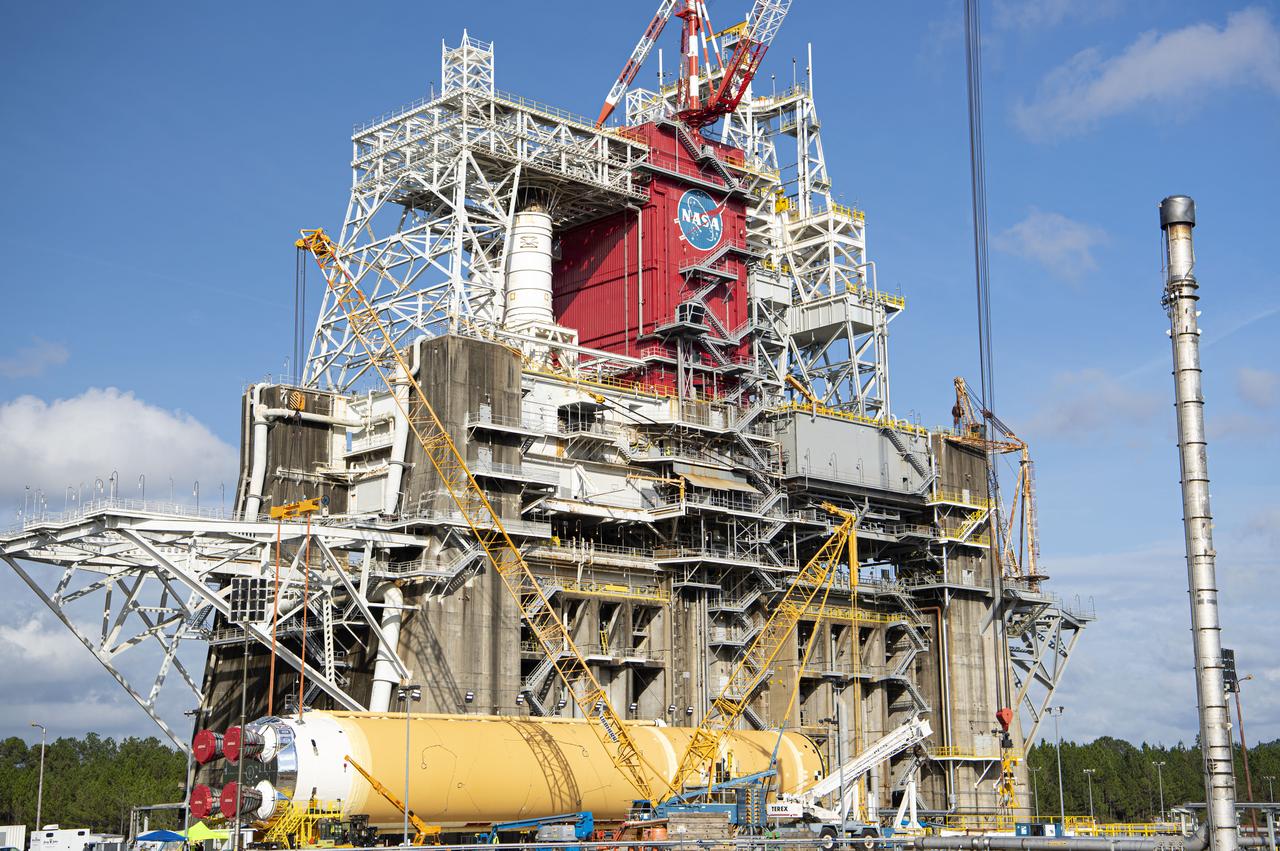 The first flight core stage for NASA’s new Space Launch System rocket arrived at Stennis Space Center on Jan. 12 for a series of tests prior to its maiden Artemis I flight. The core stage was transported from Michoud Assembly Facility in New Orleans to the B-2 Test Stand dock at Stennis aboard NASA’s Pegasus barge. Soon after arrival, the stage was rolled off of Pegasus onto the B-2 Test Stand tarmac. After the stage is lifted and installed on the B-2 stand, it will undergo a series of “Green Run” systems test that represent the first integrated testing of its sophisticated systems.