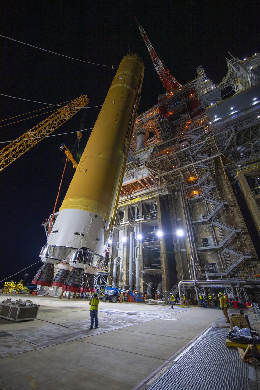 On Jan. 21-22, 2020, crews at Stennis Space Center lifted and installed the first core stage of NASA’s new Space Launch System (SLS) rocket onto the B-2 Test Stand. In upcoming months, a top-to-bottom, integrated series of Green Run tests will be conducted on the stage and its sophisticated systems. Following testing, the stage will be used to help launch the maiden Artemis I test mission of SLS and the Orion spacecraft. Through the Artemis program, NASA will send humans, including the first woman and next man, to the Moon to establish a sustainable presence.