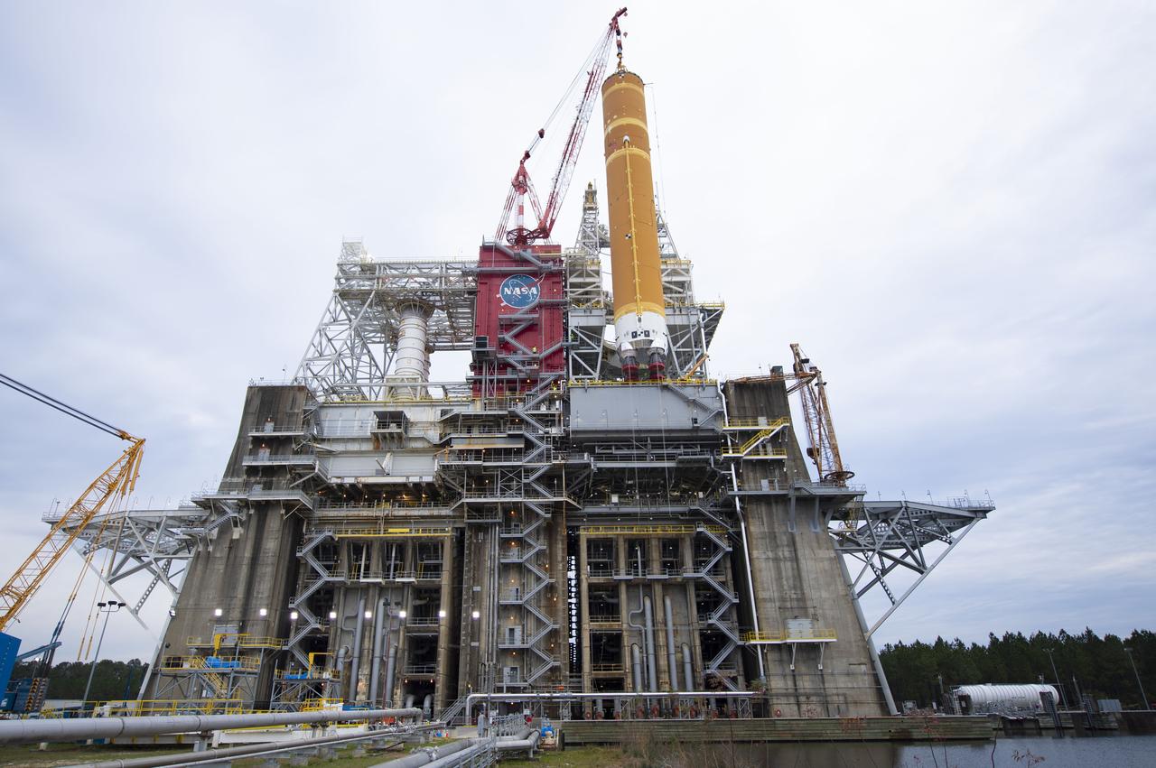 On Jan. 21-22, 2020, crews at Stennis Space Center lifted and installed the first core stage of NASA’s new Space Launch System (SLS) rocket onto the B-2 Test Stand. In upcoming months, a top-to-bottom, integrated series of Green Run tests will be conducted on the stage and its sophisticated systems. Following testing, the stage will be used to help launch the maiden Artemis I test mission of SLS and the Orion spacecraft. Through the Artemis program, NASA will send humans, including the first woman and next man, to the Moon to establish a sustainable presence.