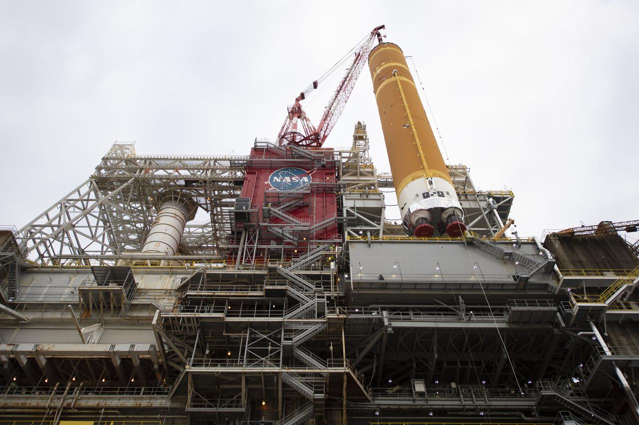 On Jan. 21-22, 2020, crews at Stennis Space Center lifted and installed the first core stage of NASA’s new Space Launch System (SLS) rocket onto the B-2 Test Stand. In upcoming months, a top-to-bottom, integrated series of Green Run tests will be conducted on the stage and its sophisticated systems. Following testing, the stage will be used to help launch the maiden Artemis I test mission of SLS and the Orion spacecraft. Through the Artemis program, NASA will send humans, including the first woman and next man, to the Moon to establish a sustainable presence.