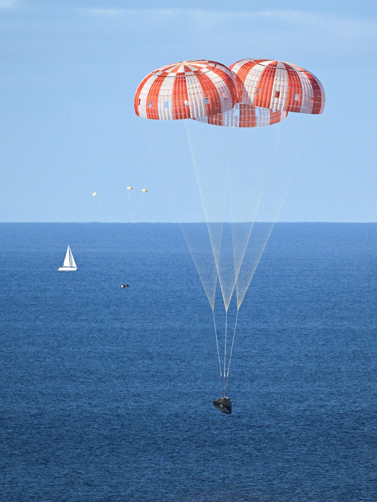 jsc2026e022246 (April 10, 2026) - NASA's Orion spacecraft carrying Artemis II Commander Reid Wiseman, Pilot Victor Glover, and Mission Specialist Christina Koch from NASA, along with Mission Specialist Jeremy Hansen from the CSA (Canadian Space Agency), splashes down in the Pacific Ocean near San Diego, California, at 5:07 p.m. PDT, (8:07 p.m. EDT) on Friday, April 10, 2026. The Artemis II test flight launched on Wednesday, April 1, from NASA’s Kennedy Space Center in Florida to begin its 10-day journey around the Moon for scientific discovery, economic benefits, and to build on our foundation for the first crewed missions to Mars. NASA’s Landing and Recovery team and the U.S. military are coordinating efforts to extract the Artemis II crew from the Orion spacecraft.  