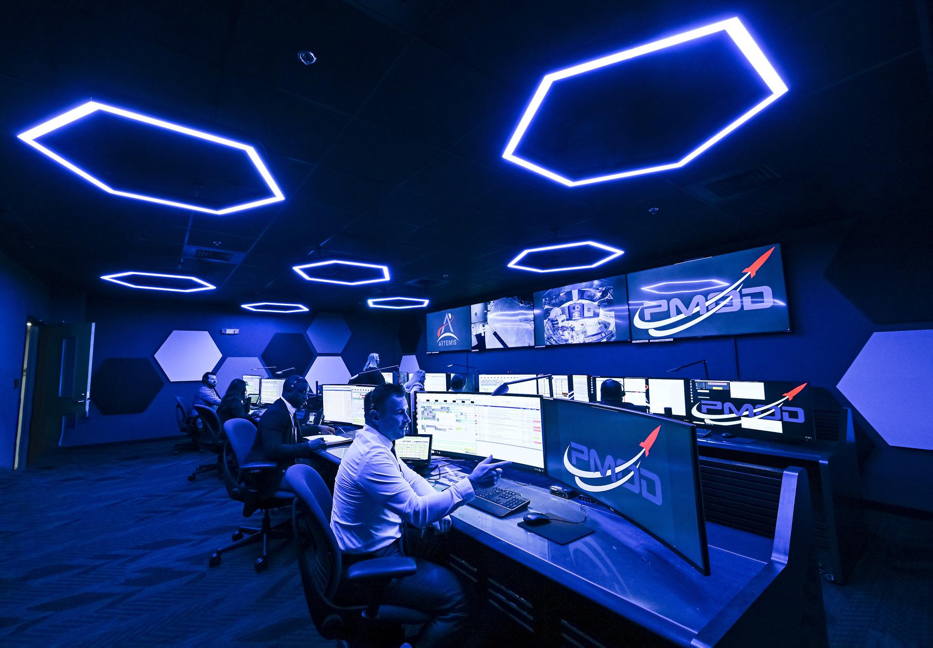 These photos offer a look inside the twin control rooms at NASA’s Marshall Space Flight Center in Huntsville, Alabama, where engineers will monitor Artemis science and future landing operations for Artemis. The LUCA (Lunar Utilization Control Area) and LESA (Lander Engineering Support Area) rooms are part of the Huntsville Operations Support Center at NASA Marshall. The LUCA is specially designed to support a wide variety of science operations on and around the Moon – and beyond. Engineers in the LUCA monitored operations for the Lunar Node-1 experiment, an autonomous navigation payload that was part of the first NASA Commercial Lunar Payload Services (CLPS) launch on Intuitive Machines’ Nova-C lunar lander in 2024. NASA Marshall flight controllers will use the LUCA again for Artemis II to monitor science operations. Beginning with Artemis III, members of the NASA Human Landing System Mission Insight Support Team – a group of engineers, safety leads, flight operations experts, and technical authorities – will work in the LESA. There, they will monitor lander systems in real-time and be involved in key decision-making processes throughout the mission. For more information, contact NASA Marshall’s Office of Communications at 256-544-0034.