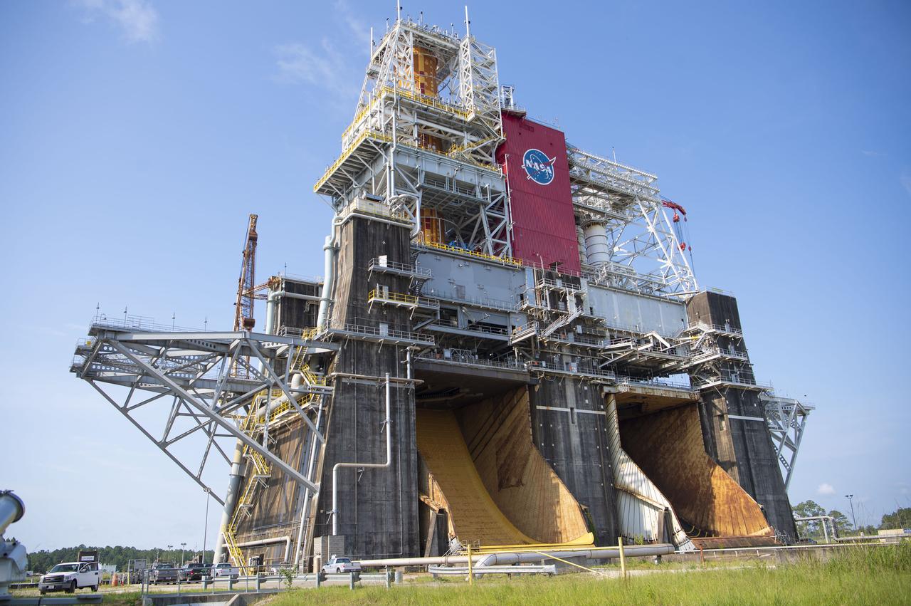 A photo from the north (flame trench) side of the B-2 Test Stand at NASA’s Stennis Space Center shows the first flight core stage for NASA’s new Space Launch System (SLS) rocket installed for Green Run testing. The SLS core stage was transported to Stennis in January to begin Green Run testing prior to its use on the Artemis I mission. NASA is building SLS to return humans, including the first woman, to the Moon as part of the Artemis program and to prepare for eventual missions to Mars. At Stennis, the SLS core stage will undergo a series of tests on its integrated systems, culminating with a hot fire of its four RS-25 engines, just as during an actual launch.