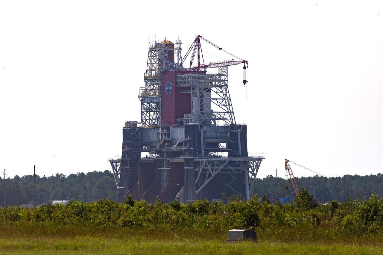 A photo from the north (flame trench) side of the B-2 Test Stand at NASA’s Stennis Space Center shows the first flight core stage for NASA’s new Space Launch System (SLS) rocket installed for Green Run testing. The SLS core stage was transported to Stennis in January to begin Green Run testing prior to its use on the Artemis I mission. NASA is building SLS to return humans, including the first woman, to the Moon as part of the Artemis program and to prepare for eventual missions to Mars. At Stennis, the SLS core stage will undergo a series of tests on its integrated systems, culminating with a hot fire of its four RS-25 engines, just as during an actual launch.
