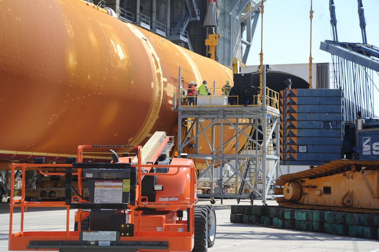 Team members at NASA’s Stennis Space Center near Bay St. Louis, Mississippi, load the first core stage of the agency’s Space Launch System (SLS) rocket on to the agency’s Pegasus barge in preparation for its transport to Kennedy Space Center in Florida. The loading activity followed removal of the stage from the B-2 Test Stand at Stennis on April 19-20, 2021. It comes about a month after NASA conducted a successful hot fire of the stage and its four RS-25 engines on March 18 and after teams completed various refurbishment activities. Once at Kennedy, the will be integrated with the rest of SLS rocket and prepared for the launch of the Artemis I mission to the Moon. Photo Credit: NASA