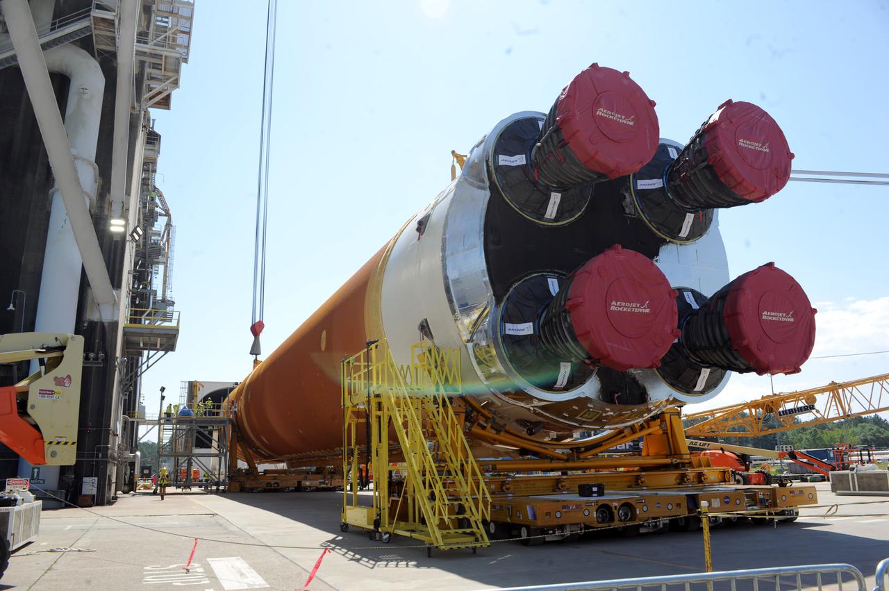 Team members at NASA’s Stennis Space Center near Bay St. Louis, Mississippi, load the first core stage of the agency’s Space Launch System (SLS) rocket on to the agency’s Pegasus barge in preparation for its transport to Kennedy Space Center in Florida. The loading activity followed removal of the stage from the B-2 Test Stand at Stennis on April 19-20, 2021. It comes about a month after NASA conducted a successful hot fire of the stage and its four RS-25 engines on March 18 and after teams completed various refurbishment activities. Once at Kennedy, the will be integrated with the rest of SLS rocket and prepared for the launch of the Artemis I mission to the Moon. Photo Credit: NASA
