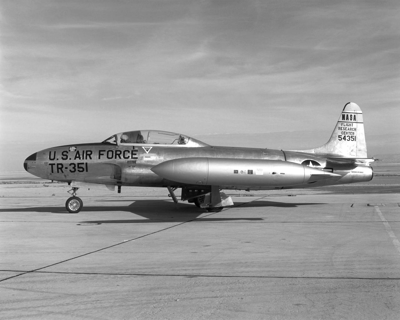 Arrived at NASA FRC January 9, 1963 Departed September 10, 1973 to Redding, California This aircraft, one of four T-33A jet trainers which NASA Dryden used from 1958 to 1973, was used in a monocular vision landing study. The T-33 was the first U.S. Air Force jet trainer, and was originally developed as a two-seat version of the F-80. The T-33 was used by not only the U.S. military, but also by foreign air forces as a trainer, fighter, and reconnaissance aircraft.