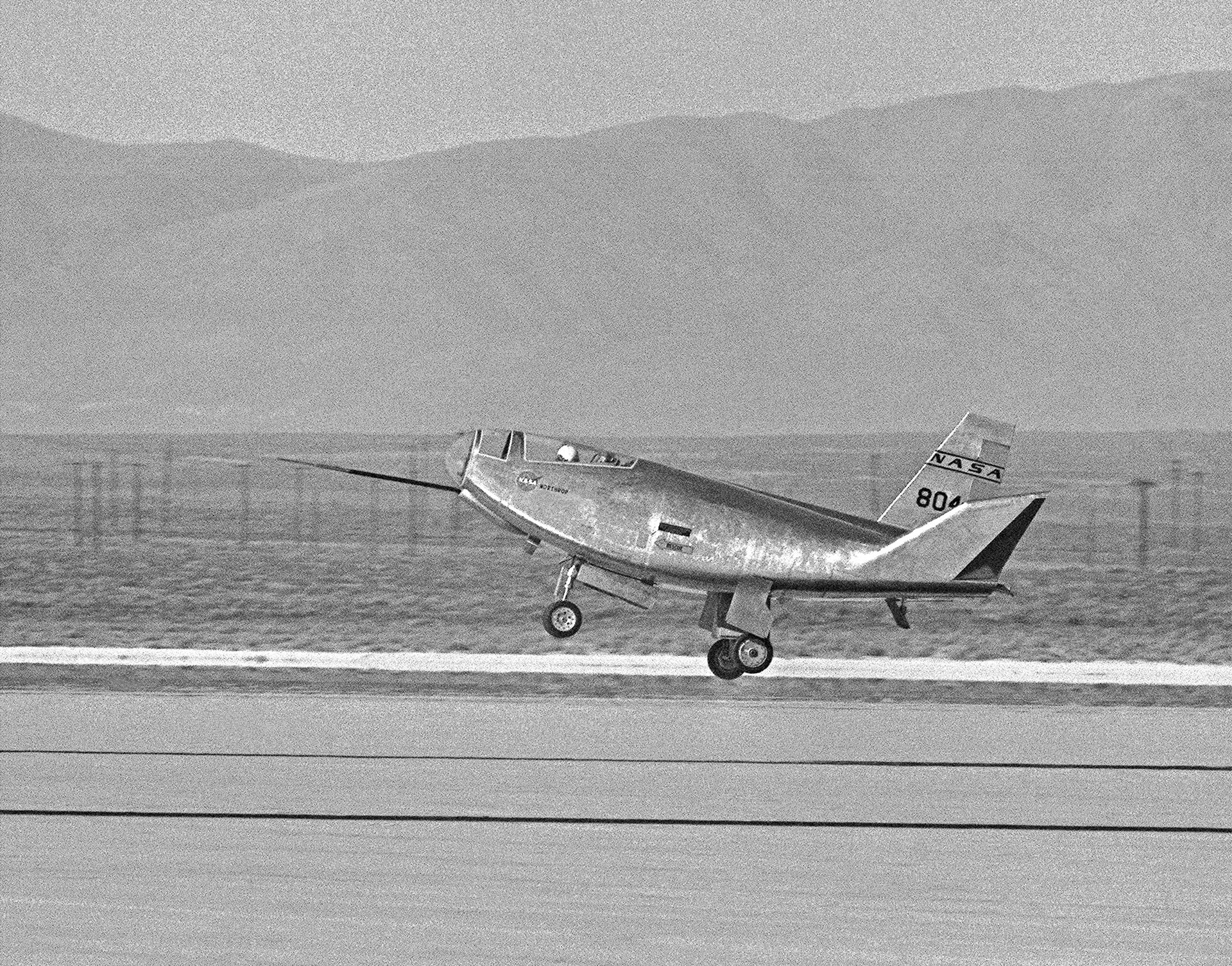 The HL-10 aircraft touches down at Rogers Dry Lake.