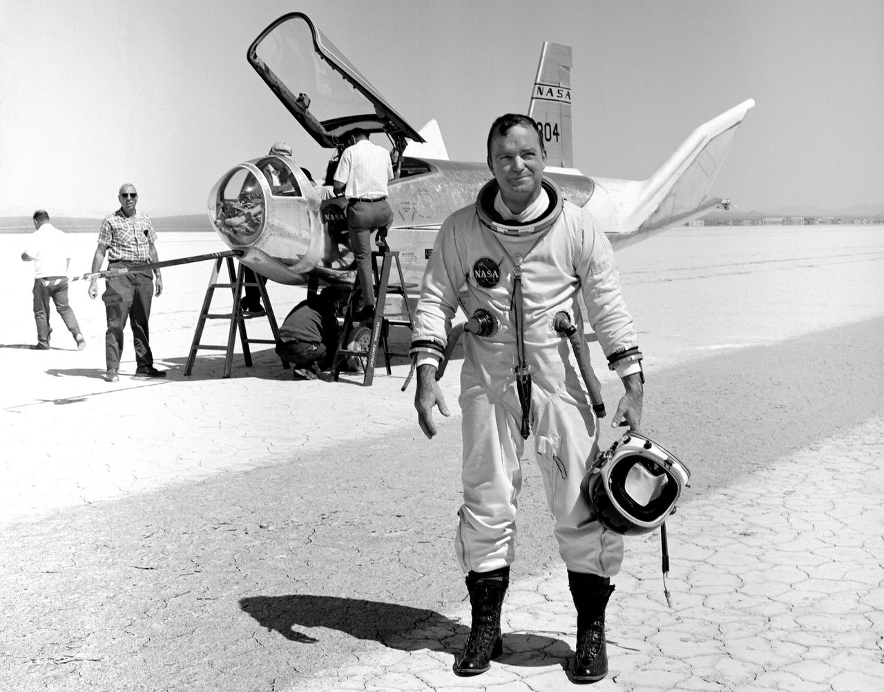 NASA research pilot Bill Dana stands in front of the HL-10 Lifting Body following his first glide flight on April 25, 1969. Dana later retired as Chief Engineer at NASA's Dryden Flight Research Center, (called the NASA Flight Research Center in 1969). Prior to his lifting body assignment, Dana flew the X-15 research airplane. He flew the rocket-powered aircraft 16 times, reaching a top speed of 3,897 miles per hour and a peak altitude of 310,000 feet (almost 59 miles high).