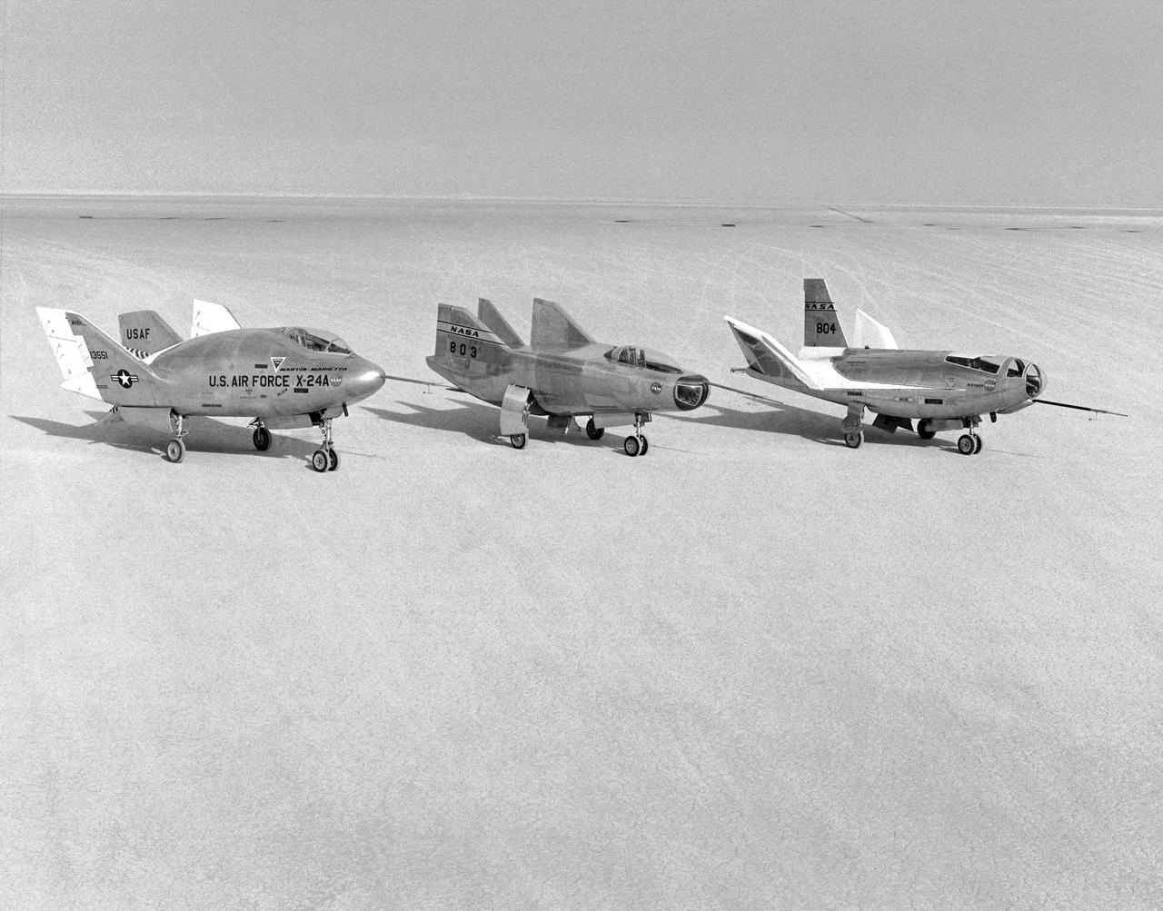 The wingless, lifting body aircraft sitting on Rogers Dry Lake at what is now NASA's Dryden Flight Research Center, Edwards, California, from left to right are the X-24A, M2-F3 and the HL-10. The lifting body aircraft studied the feasibility of maneuvering and landing an aerodynamic craft designed for reentry from space. These lifting bodies were air launched by a B-52 mother ship, then flew powered by their own rocket engines before making an unpowered approach and landing. They helped validate the concept that a space shuttle could make accurate landings without power. The X-24A flew from April 17, 1969 to June 4, 1971. The M2-F3 flew from June 2, 1970 until December 20, 1972. The HL-10 flew from December 22, 1966 until July 17, 1970 and logged the highest and fastest records in the lifting body program.