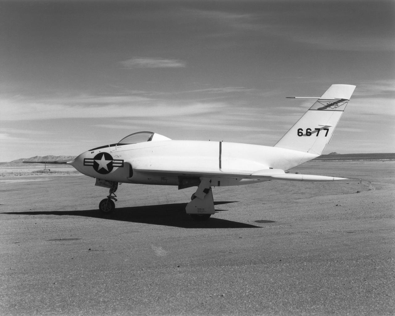 In this 1950 view of the left side of the NACA High-Speed Flight Research Station's X-4 research aircraft, the low swept wing and horizontal taillest design are seen. The X-4 Bantam, a single-place, low swept-wing, semi-tailless aircraft, was designed and built by Northrop Aircraft, Inc. It had no horizontal tail surfaces and its mission was to obtain in-flight data on the stability and control of semi-tailless aircraft at high subsonic speeds.