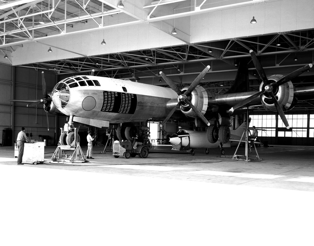 D-558-2 being mounted to P2B-1S launch aircraft in hangar.