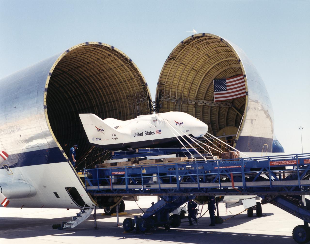 The X-38 Vehicle 131R, intended to prove the utility of a "lifeboat" crew return vehicle to bring crews home from the International Space Station in the event of an emergency, was unloaded from NASA's Super Guppy transport aircraft on July 11, 2000. The newest X-38 version arrived at Dryden for drop tests from NASA's venerable B-52 mother ship. The tests will evaluate a 7,500 square-foot parafoil intended to permit the CRV to return from space and land in the length of a football field.