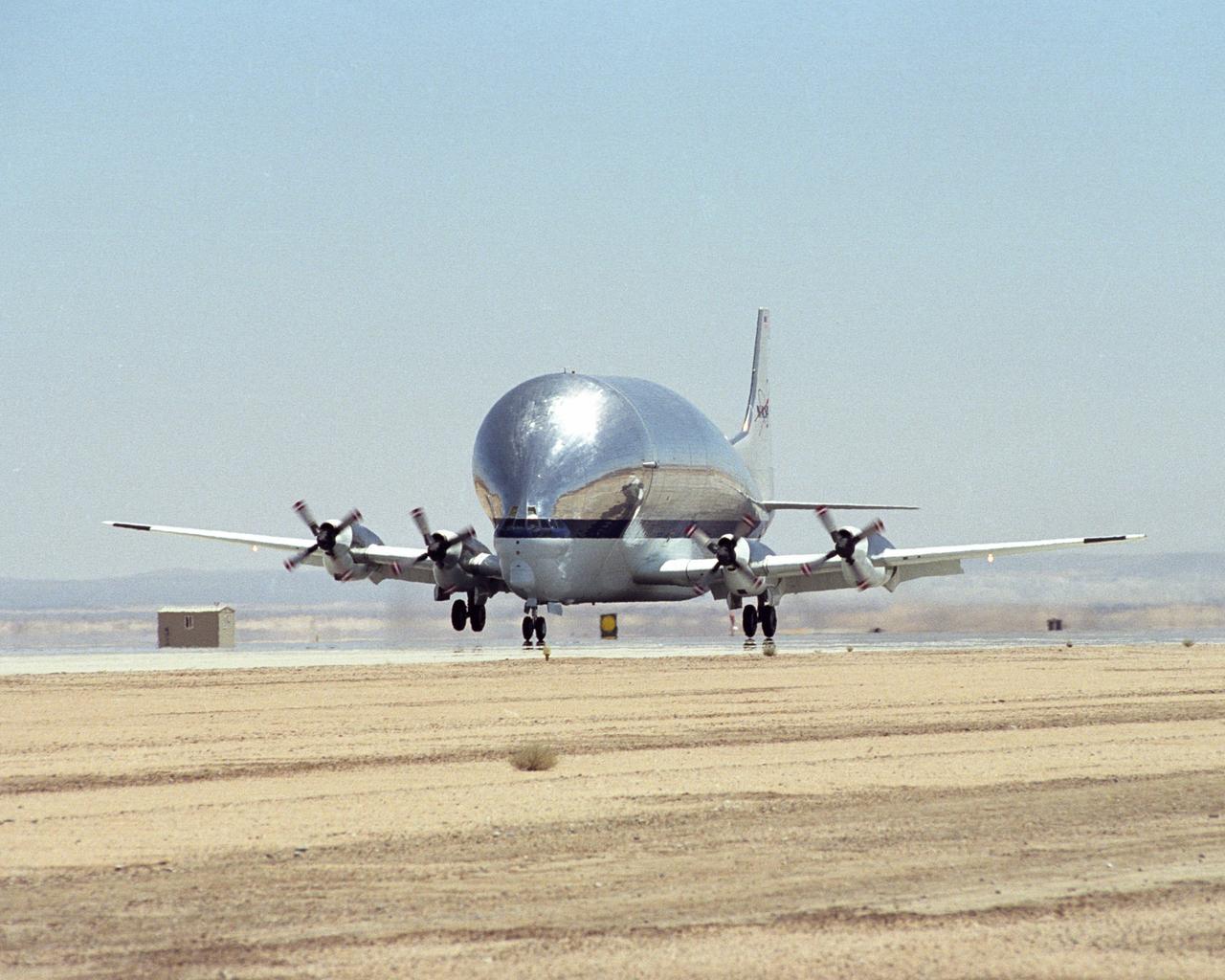 NASA's B377SGT Super Guppy Turbine cargo aircraft touches down at Edwards Air Force Base, Calif. on June 11, 2000 to deliver the latest version of the X-38 flight test vehicle to NASA's Dryden Flight Research Center.