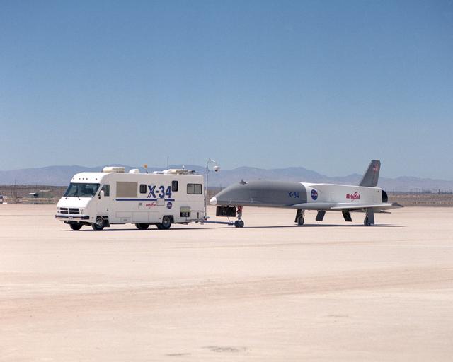 X-34 being towed by the Mobile Operations Module during navigational tests on the Rogers Dry Lakebed