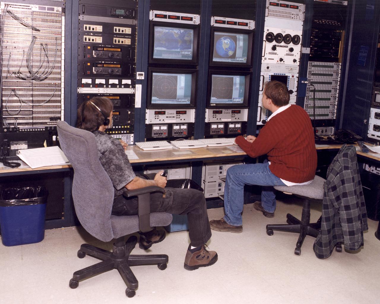 Mike Yettaw and Donavon Hoover providing air-to-ground communications to the Johnson Space Center during STS-92.