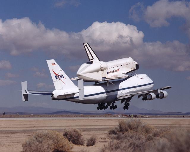 NASA image: NASA's space shuttle Atlantis and its 747 carrier taxied on the Edwards Air Force Base flightline as the unusual combination left for Kennedy Space Center, Florida, on March 1, 2001