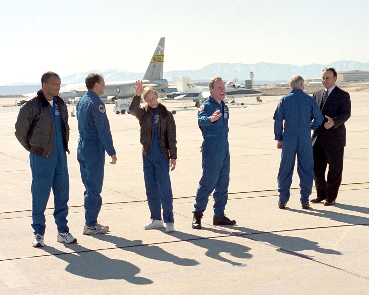 The five crew members of the Space Shuttle Atlantis on the STS-98 mission depart NASA Dryden to return to the Johnson Space Center at Houston. They briefly extended greetings to Dryden staff members on the ramp area behind Dryden's Main Building at a crew ceremony on February 21, 2001.