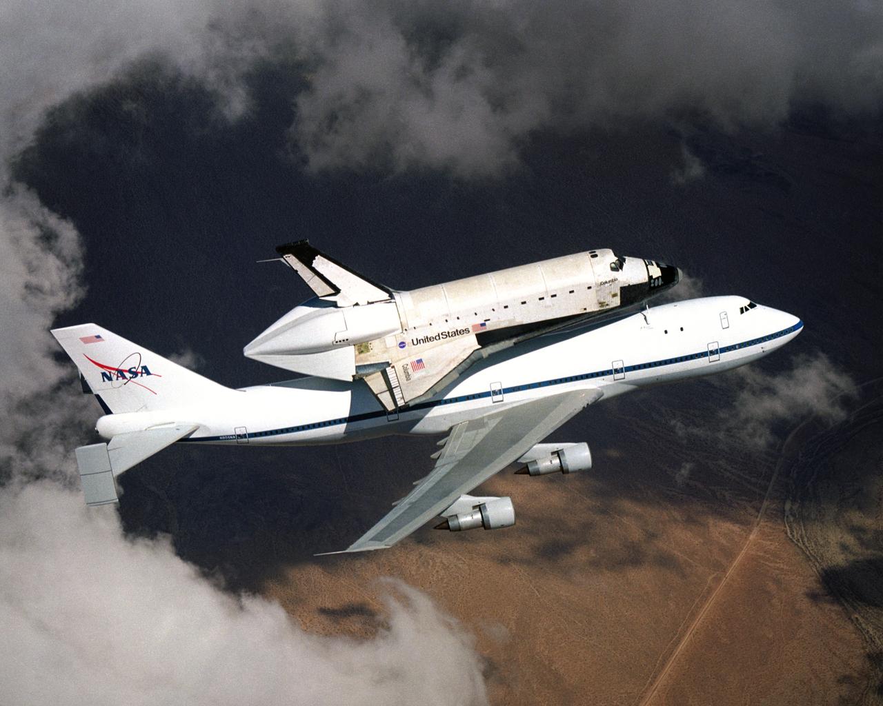 NASA space shuttle Columbia hitched a ride on a special 747 carrier aircraft for the flight from Palmdale, California, to Kennedy Space Center, Florida, on March 1, 2001. A half hour behind Columbia's takeoff, the shuttle Atlantis departed the NASA Dryden Flight Research Center at Edwards Air Force Base, California, also bound for Kennedy Space Center.