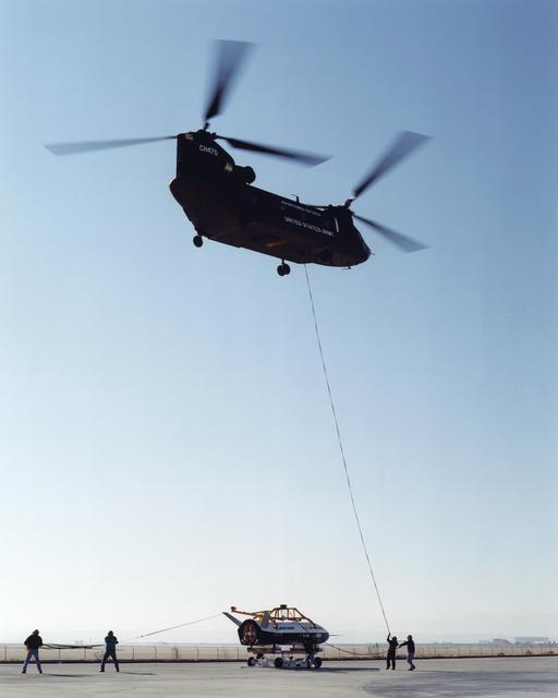 Wranglers steadied the X-40A at NASA's Dryden Flight Research Center, Edwards, California, March 14, 2001, as the experimental craft was carried to 15,000 feet for an unpiloted glide flight
