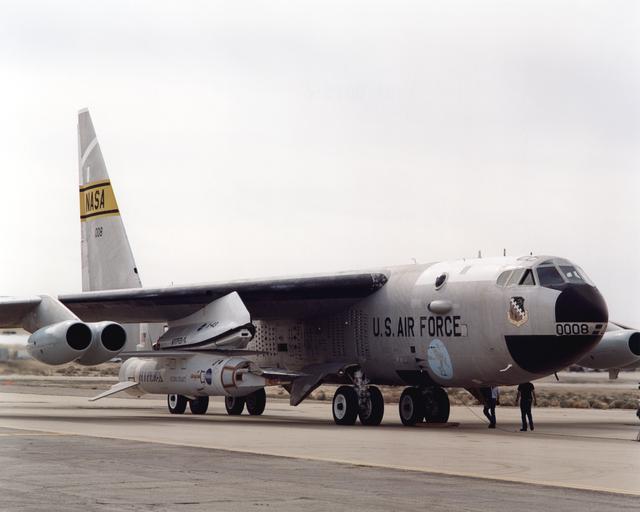 The X-43A hypersonic research aircraft and its modified Pegasus® booster rocket nestled under the wing of NASA's NB-52B carrier aircraft during pre-flight systems testing