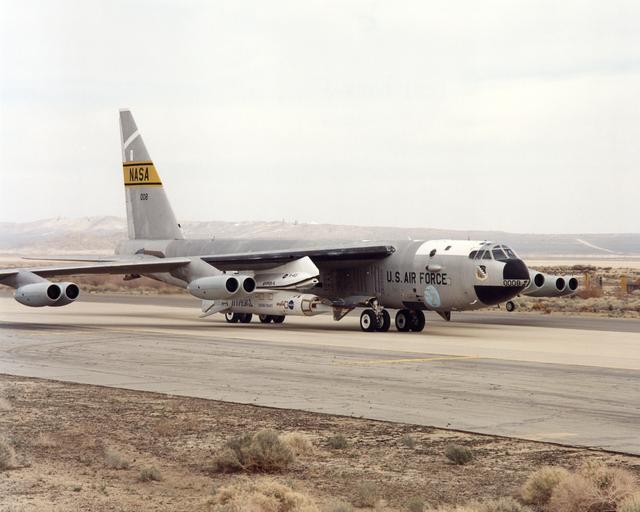 NASA's NB-52B carrier aircraft rolls down a taxiway with the X-43A hypersonic research aircraft and its modified Pegasus® booster rocket slung from a pylon under its right wing