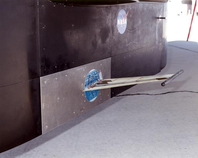The Aerostructures Test Wing (ATW), which consisted of an 18-inch carbon fiber test wing with surface-mounted piezoelectric strain actuators, was mounted on a special ventral flight test fixture and flown on Dryden's F-15B Research Testbed aircraft