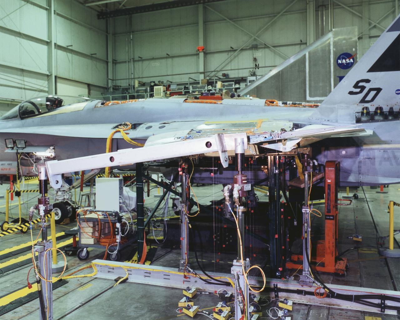 A modified F/A-18A undergoes wing torsion testing in the Flight Dynamics Laboratory at NASA's Dryden Flight Research Center, Edwards, California