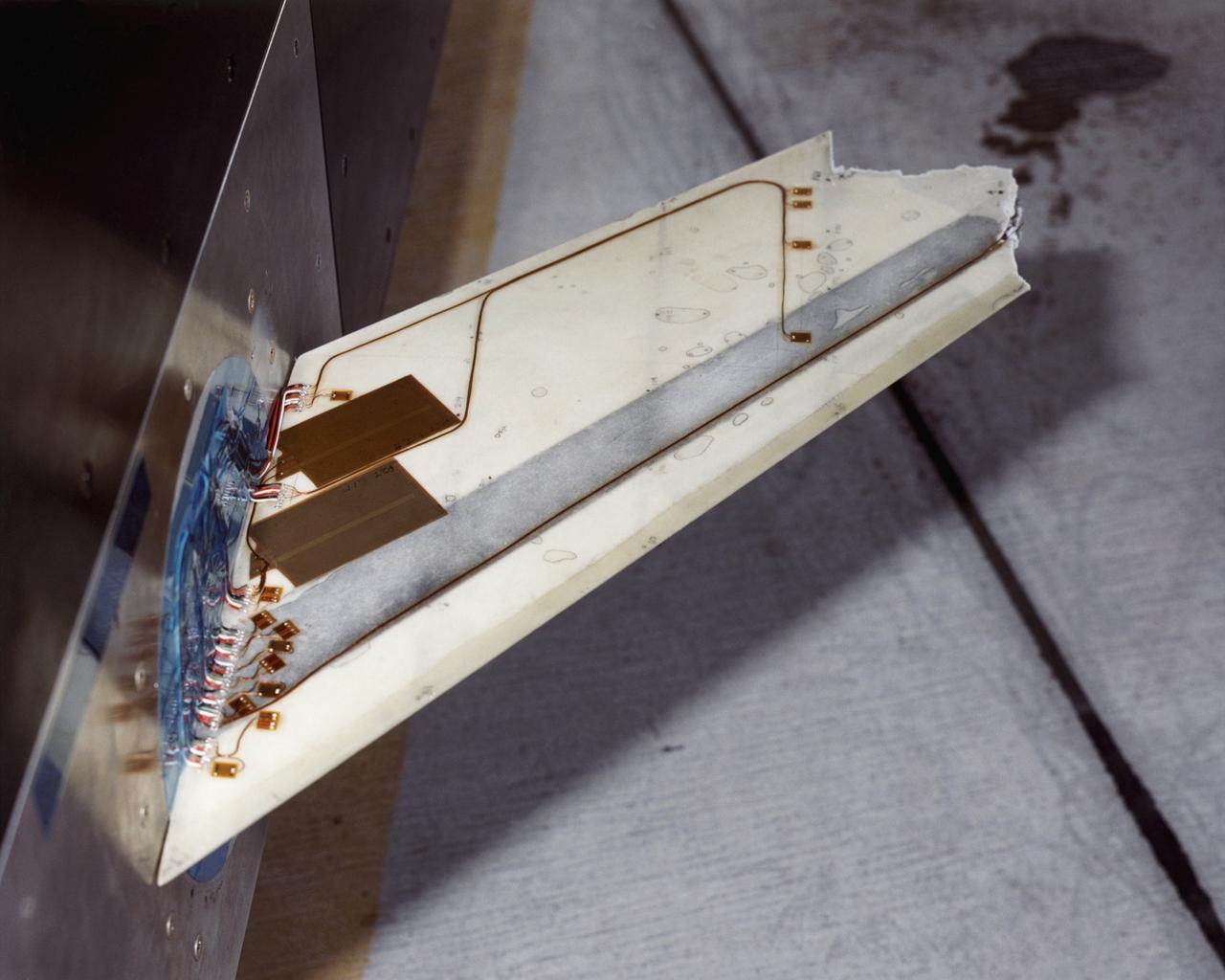 The Aerostructures Test Wing (ATW), which consisted of an 18-inch carbon fiber test wing with surface-mounted piezoelectric strain actuators, following intentional failure on its final flight