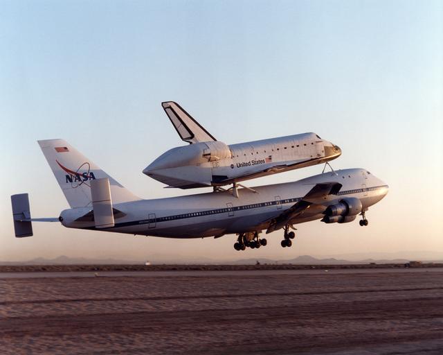NASA image: NASA's Boeing 747 SCA with the Space Shuttle Endeavour on top climbs out after takeoff from Edwards Air Force Base