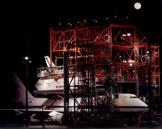 NASA image: The Space Shuttle Endeavour receives post-flight servicing in the Mate-Demate Device (MDD) at NASA's Dryden Flight Research Center, Edwards, California