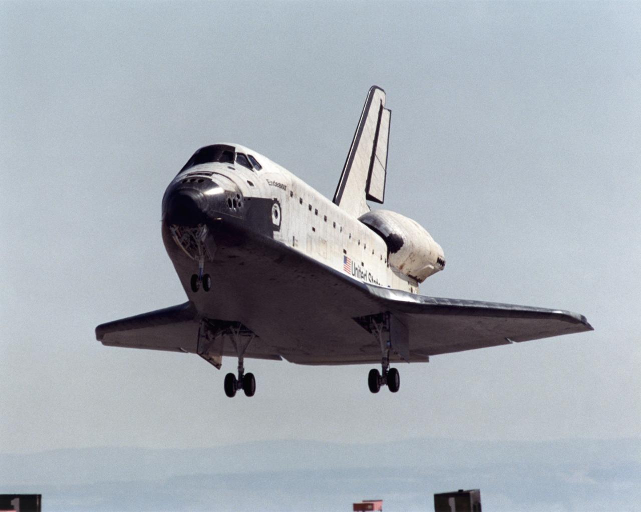 A long telephoto lens captured Space Shuttle Endeavour landing at Edwards Air Force Base, California, on May 1, 2001. NASA's Dryden Flight Research Center at Edwards would subsequently service the shuttle and mount it on a 747 for the ferry flight to the Kennedy Space Center in Florida.