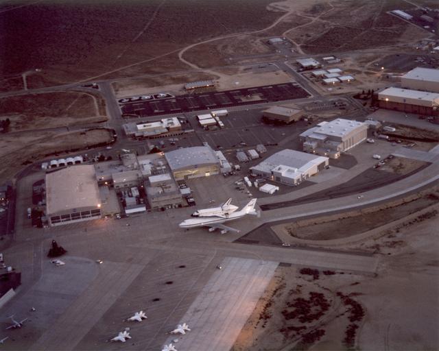 NASA image: Aerial photo of NASA Dryden Flight Research Center with the Endeavour Space Shuttle and 747 Shuttle Carrier Aircraft taxiing on ramp