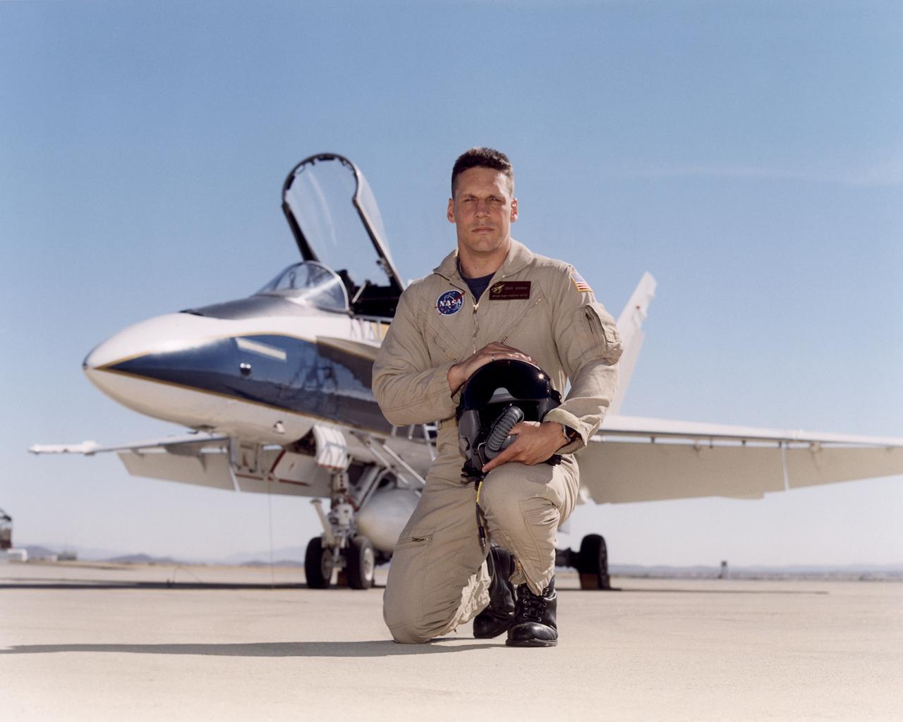 Craig R. Bomben became a pilot in the Flight Crew Branch of NASA's Dryden Flight Research Center, Edwards, Calif., in June 2001. His flying duties include a variety of research and support activities while piloting the F/A-18, DC-8, T-34C and King Air aircraft. He has more than 17 years and 3,800 hours of military and civilian flight experience in over 50 different aircraft types. Bomben came to NASA Dryden from a U.S. Navy assignment to the Personnel Exchange Program, Canada. He served as a test pilot in the Canadian Armed Forces located in Cold Lake, Alberta. He participated in numerous developmental programs to include CT-133 airborne ejection seat testing, F/A-18 weapons flutter testing and F/A-18 night vision goggles integration.  Bomben performed U.S. Navy fleet service in 1995 as a strike-fighter department head. He completed two overseas deployments onboard the USS George Washington and USS Stennis. As a combat strike leader, he headed numerous multi-national missions over Iraq in support of Operation Southern Watch.  Bomben graduated from the U.S. Naval Test Pilot School in 1992 and was subsequently assigned to the Naval Weapons Test Squadron at Pt. Mugu, Calif. During this tour he developed the F-14D bombsight and worked on various other F-14D and F/A-18 weapon systems developmental programs.  Bomben is a 1985 graduate of Washington State University with a bachelor of science degree in electrical engineering. He graduated from naval flight training in 1987 and was recognized as a Commodore List graduate. His first assignment was to Naval Air Station Pensacola, Fla., where he was an instructor in the T-2B Buckeye. When selected to fly the F/A-18 in 1989, he joined a fleet squadron and deployed aboard the USS Forrestal.  Bomben is married to the former Aissa Asuncion. They live in Lancaster, Calif., with their 3 children.
