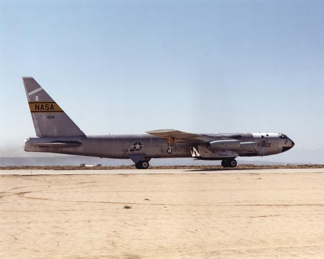NASA image: NASA's B-52 takes the X-38 aloft for the seventh free flight of the program, July 10, 2001