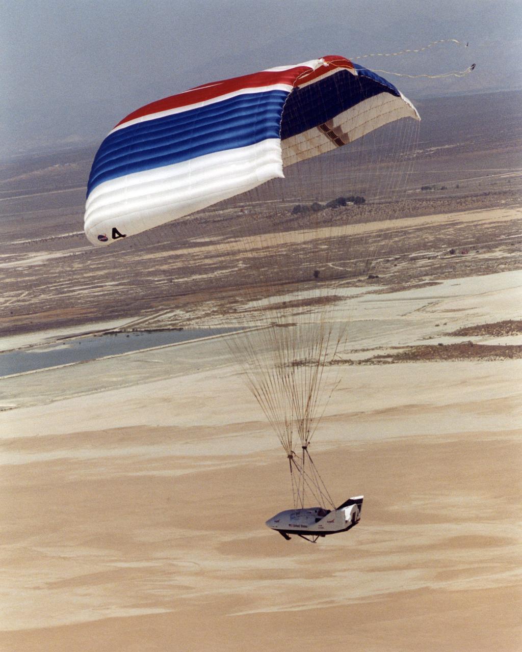 The seventh free flight of an X-38 prototype for an emergency space station crew return vehicle culminated in a graceful glide to landing under the world's largest parafoil. The mission began when the X-38 was released from NASA's B-52 mother ship over Edwards Air Force Base, California, where NASA Dryden Flight Research Center is located. The July 10, 2001 flight helped researchers evaluate software and deployment of the X-38's drogue parachute and subsequent parafoil. NASA intends to create a space-worthy Crew Return Vehicle (CRV) to be docked to the International Space Station as a "lifeboat" to enable a full seven-person station crew to evacuate in an emergency.