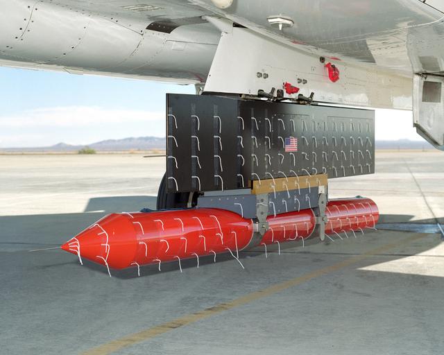 NASA image: NASA Dryden's new in-house designed Propulsion Flight Test Fixture (PFTF), carried on an F-15B's centerline attachment point, underwent flight envelope expansion in order to verify its design and capabilities.