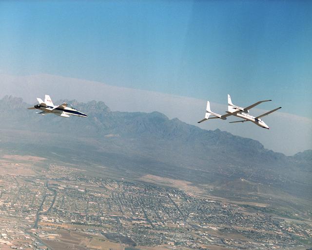 NASA image: Scaled Composites' Proteus and an F/A-18 Hornet from NASA's Dryden Flight Research Center are seen here in flight over Las Cruces, New Mexico.