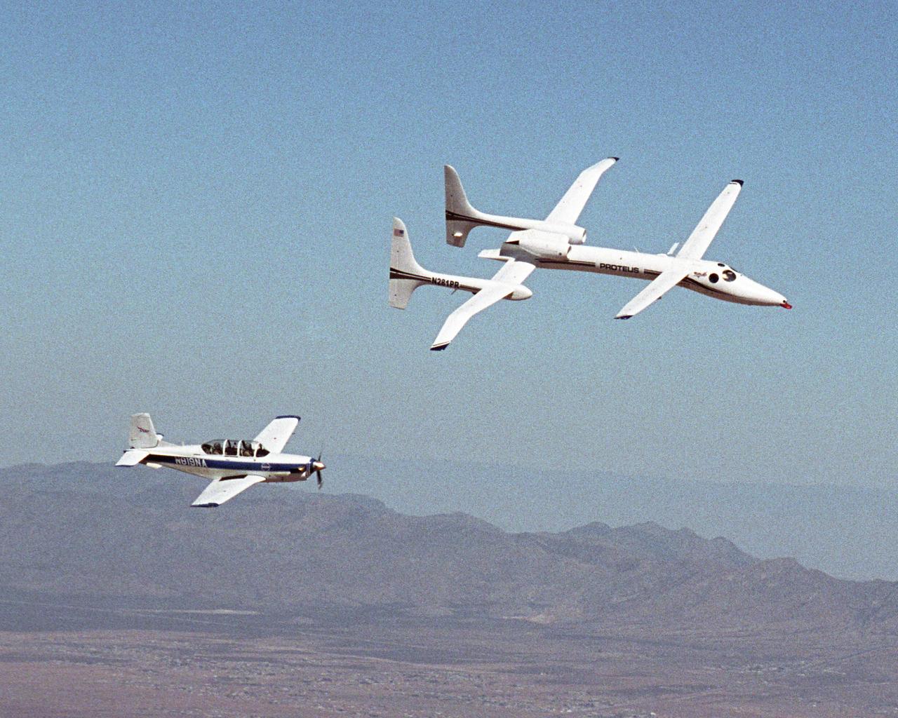 The Proteus aircraft and NASA Dryden's T-34 in flight over Las Cruces, New Mexico.