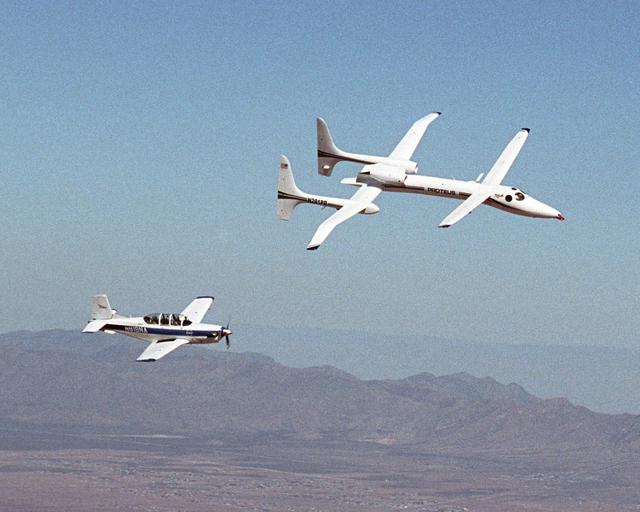 NASA image: The Proteus aircraft and NASA Dryden's T-34 in flight over Las Cruces, New Mexico.