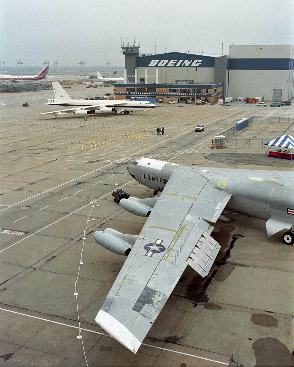 NASA's veteran silver B-52B, foreground, joined the new B-52H in NASA markings for a ceremony in Wichita, Kansas, April 12, 2002, marking the 50th anniversary of the B-52 aircraft